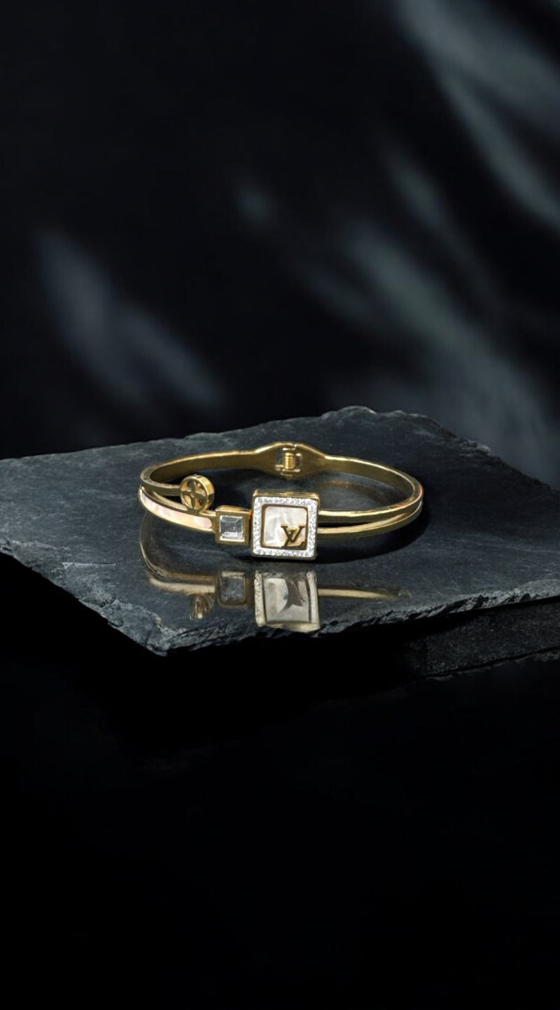 The White L and V Bangle